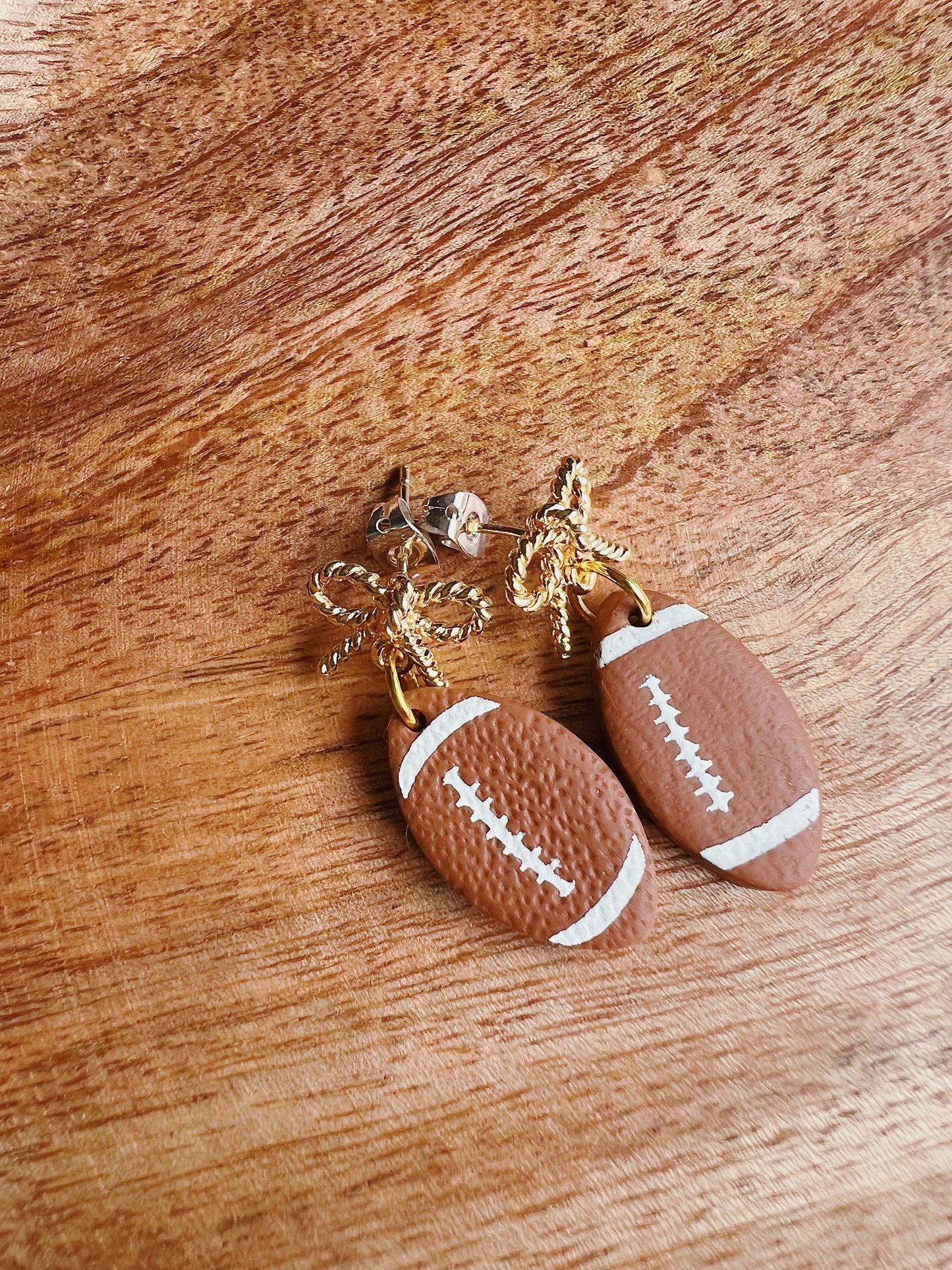 Gold Bow Football Clay Dangles